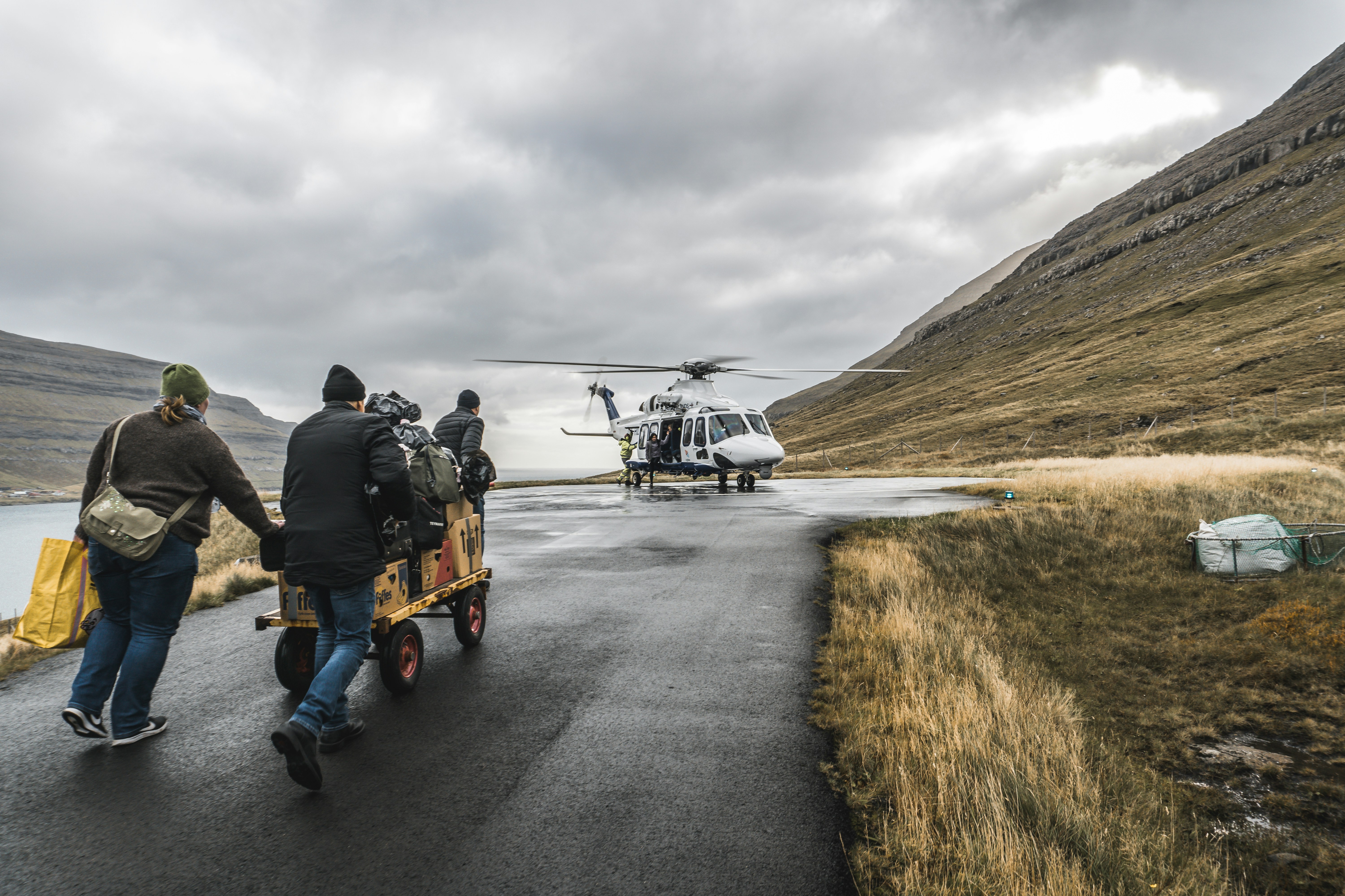 man in black jacket and blue denim jeans sitting on black and white golf cart on on on on on, 
