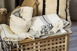 white and black floral textile on brown woven armchair