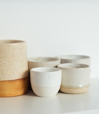 white and brown ceramic bowls
