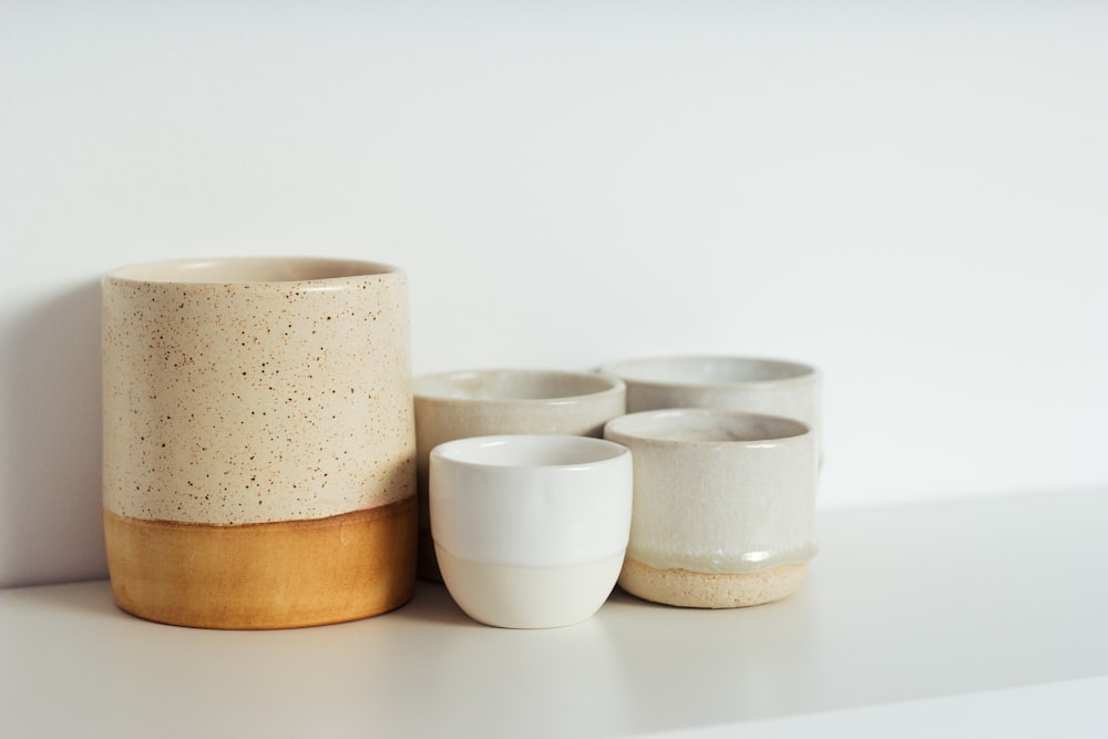 white and brown ceramic bowls