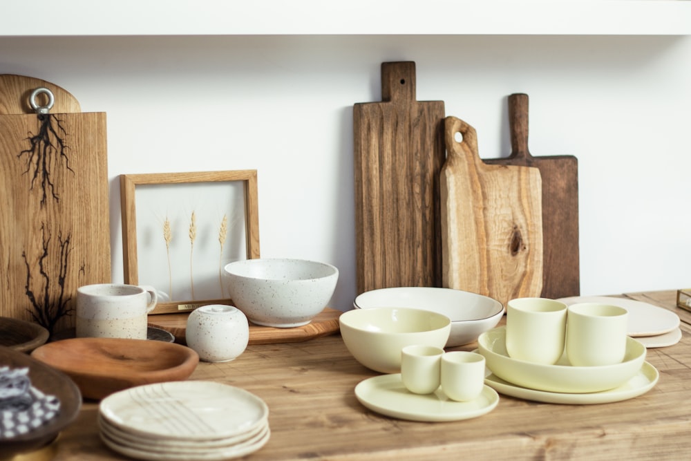white ceramic bowls on brown wooden table