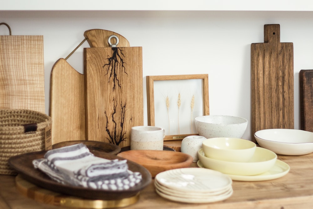 white ceramic bowls on brown wooden table