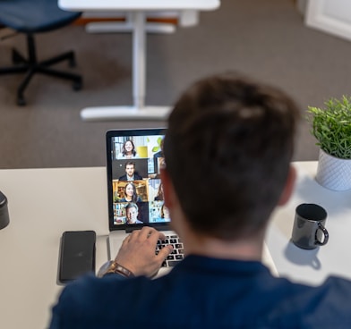 boy in blue sweater using ipad