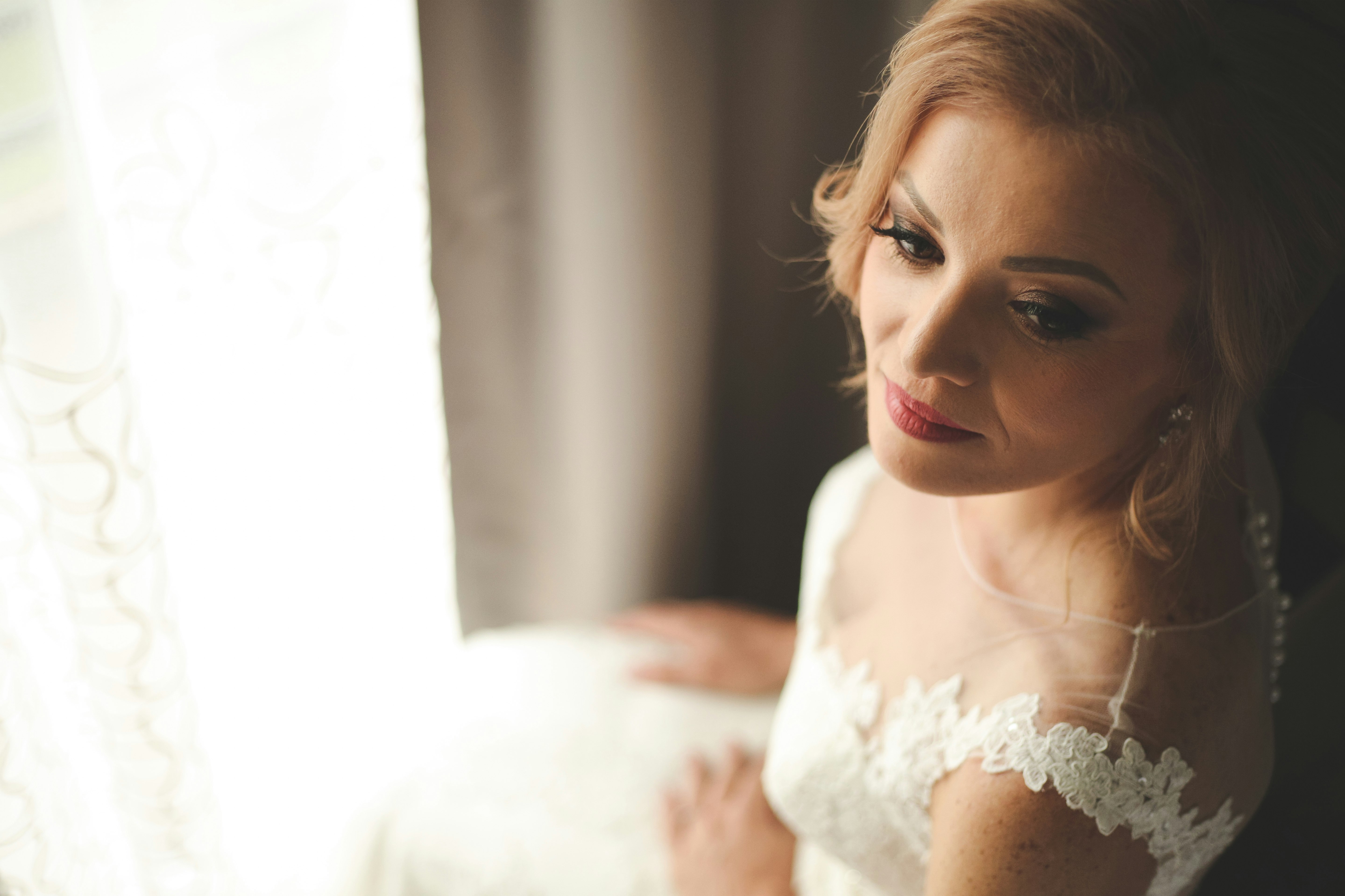 woman in white floral lace dress