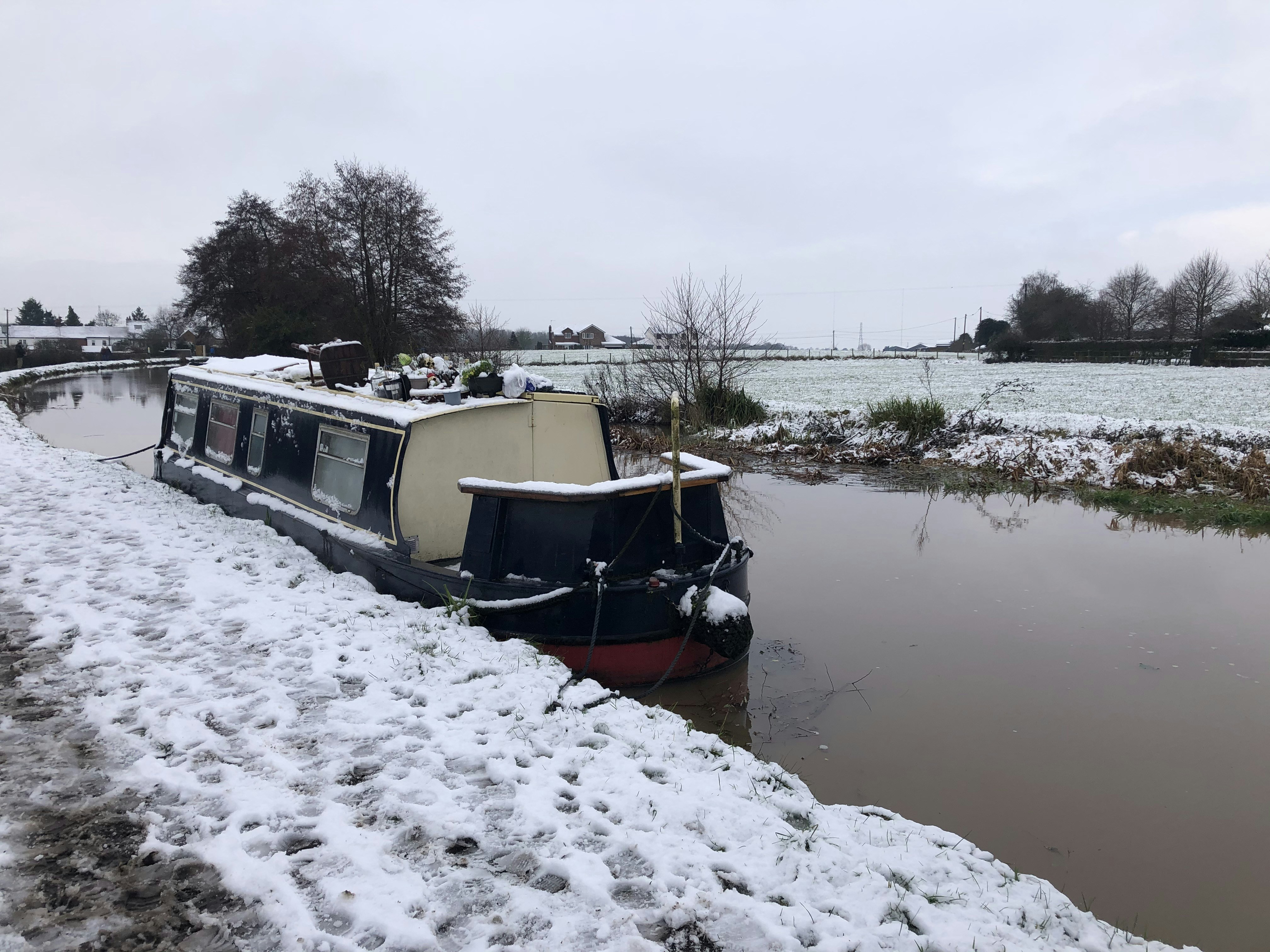 red and white boat on lake during daytime