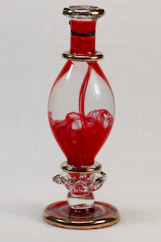 red and silver glass bottle