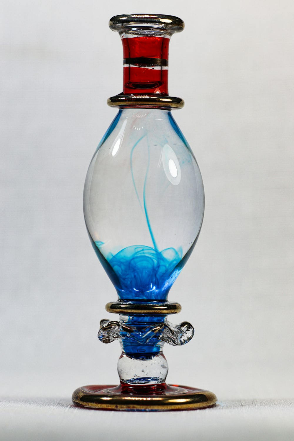 blue and red glass bottle
