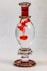 clear glass bottle with red liquid