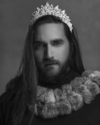 Close-up of The Emperor’s stern yet wise face, framed by a crown and a flowing beard.