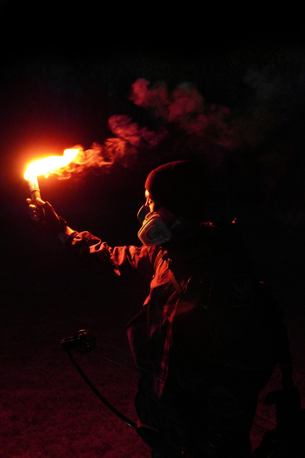 man in white and black goggles holding fire