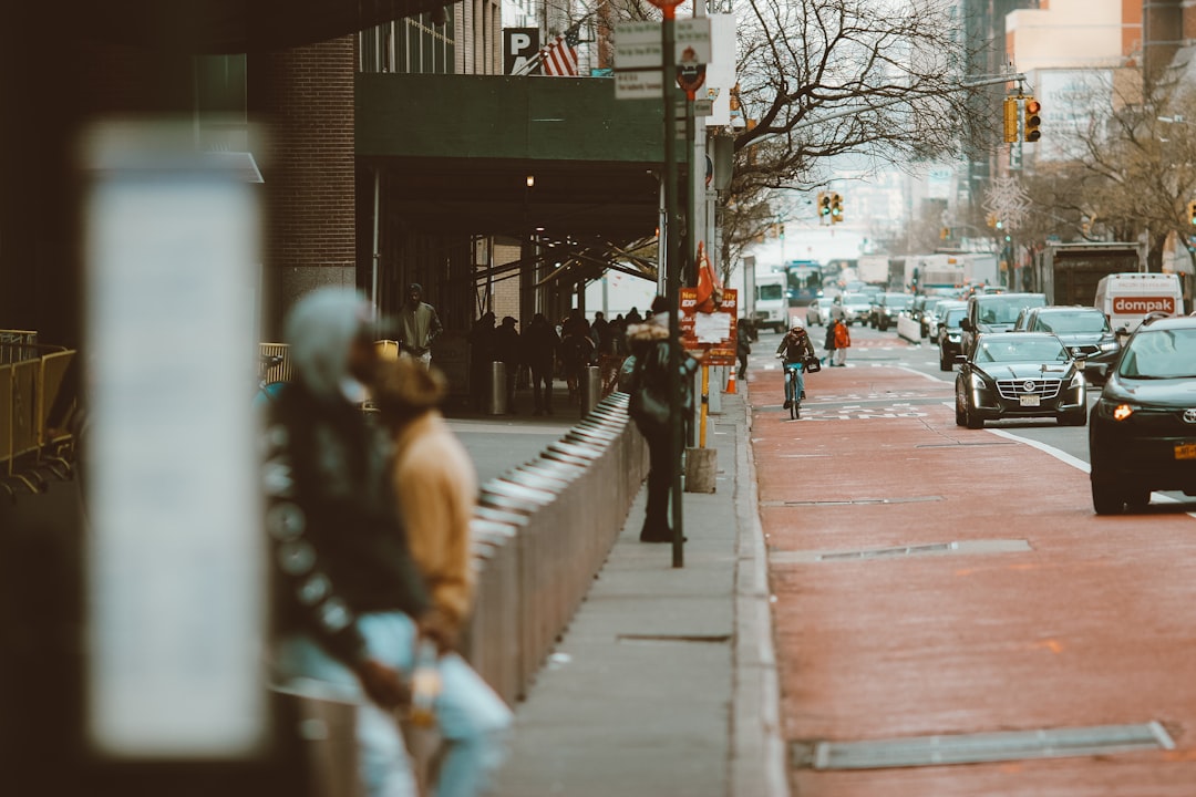 people walking on sidewalk during daytime