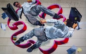 A mural depicts two men in business attire, with one appearing to have black hair and both wearing glasses. They are entangled and floating amidst swirling red ribbons and scattered papers, each holding a briefcase.