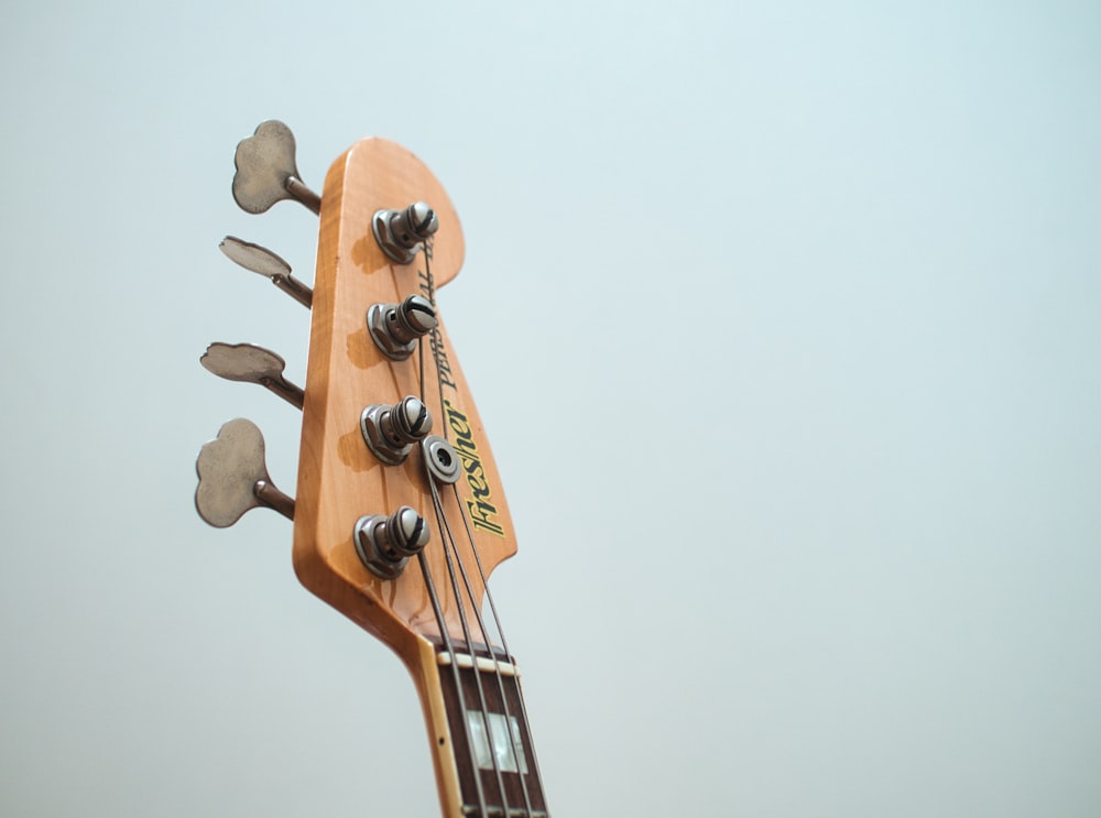 brown and black acoustic guitar