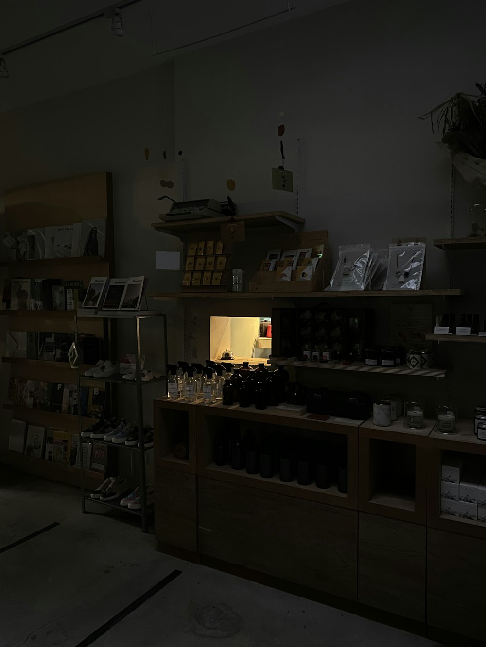 brown wooden shelf with books and bottles