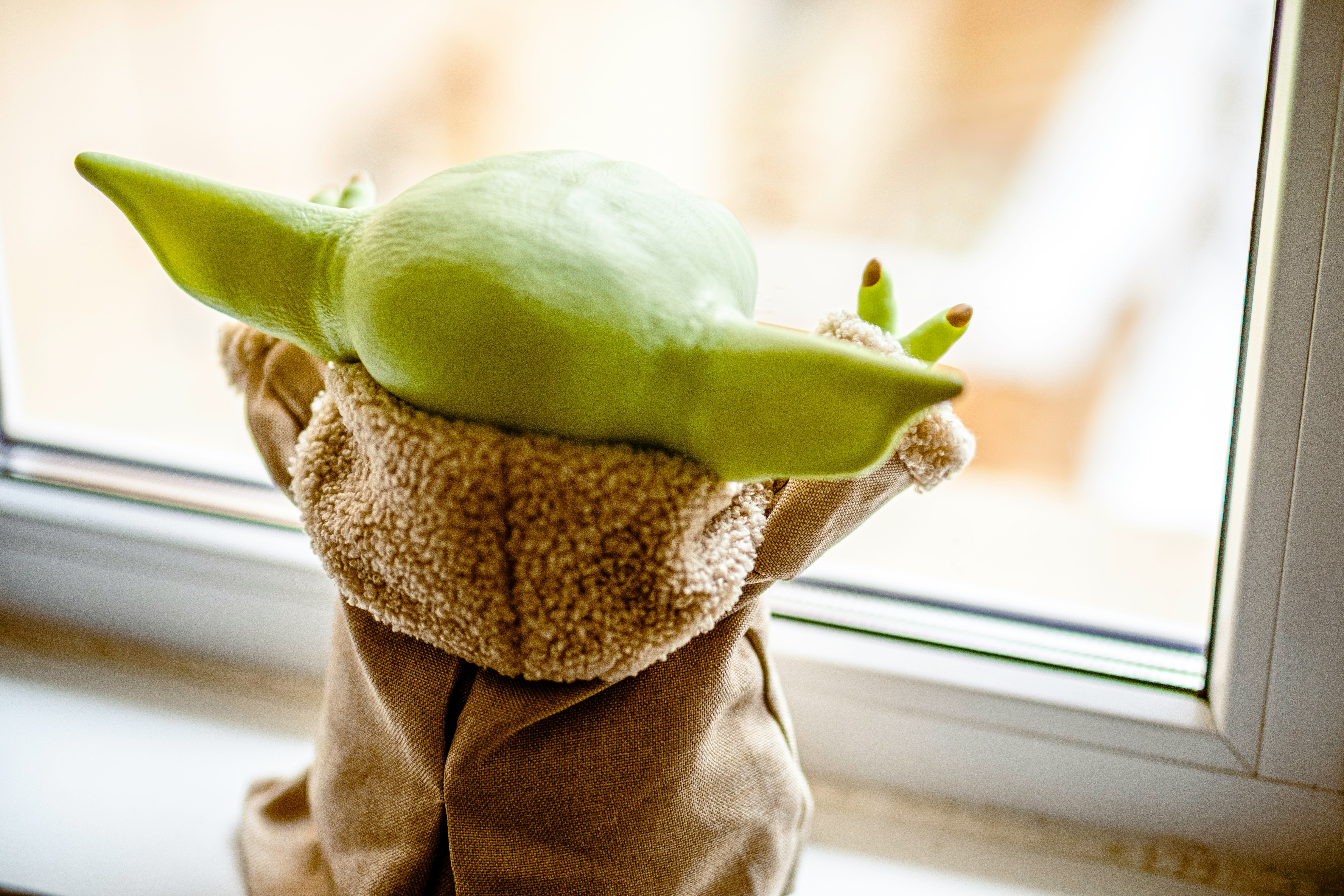 green and yellow bird plush toy