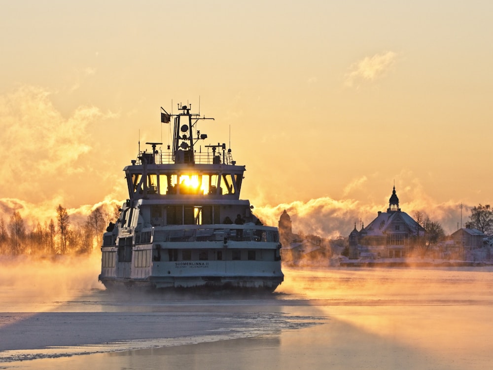 white and blue ship on sea during daytime