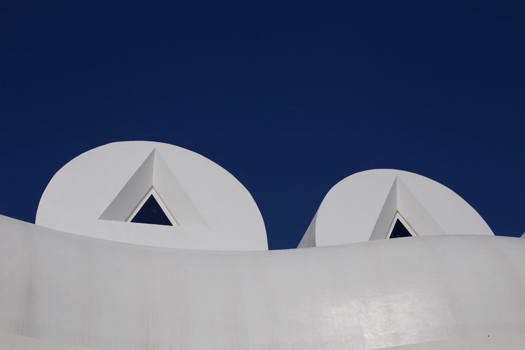 white concrete building under blue sky during daytime