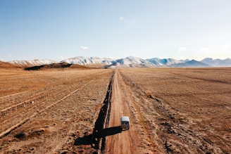 black metal rail road on brown sand