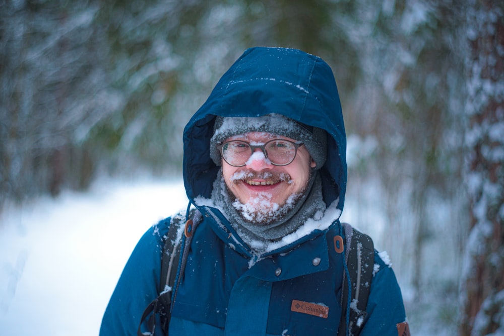 man in blue and black jacket and black knit cap