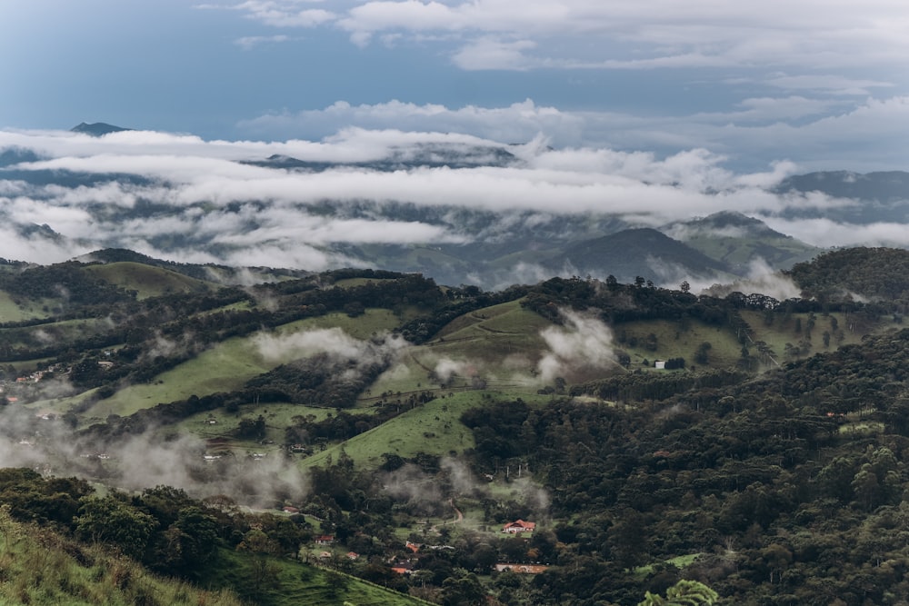 green mountains under white clouds during daytime