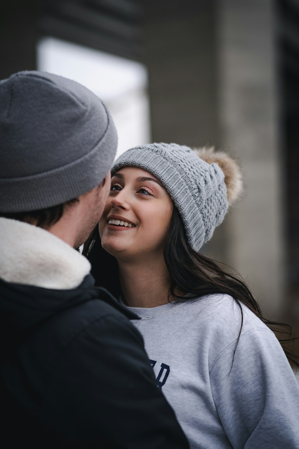 woman in gray knit cap smiling