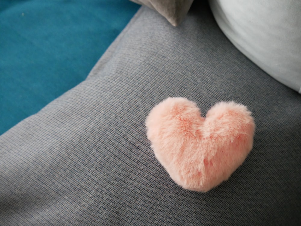 white plush toy on gray sofa