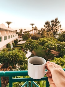 Guest enjoying a peaceful morning coffee on the villa's balcony.