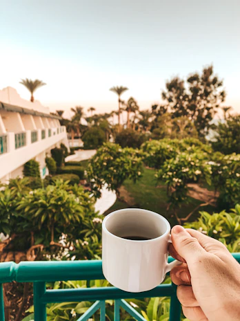 Guests enjoying a morning coffee on the balcony overlooking Kuala Lumpur’s skyline.