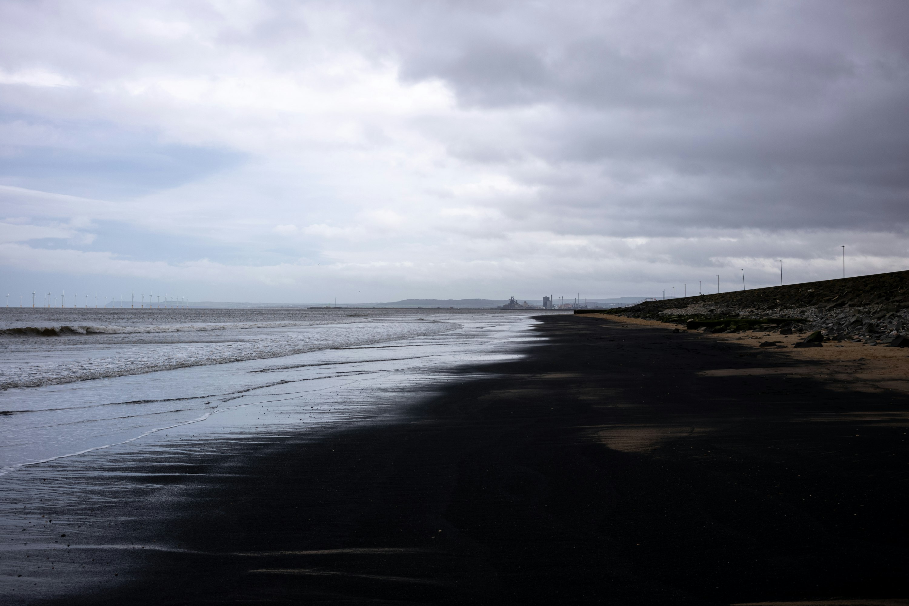 body of water under cloudy sky during daytime