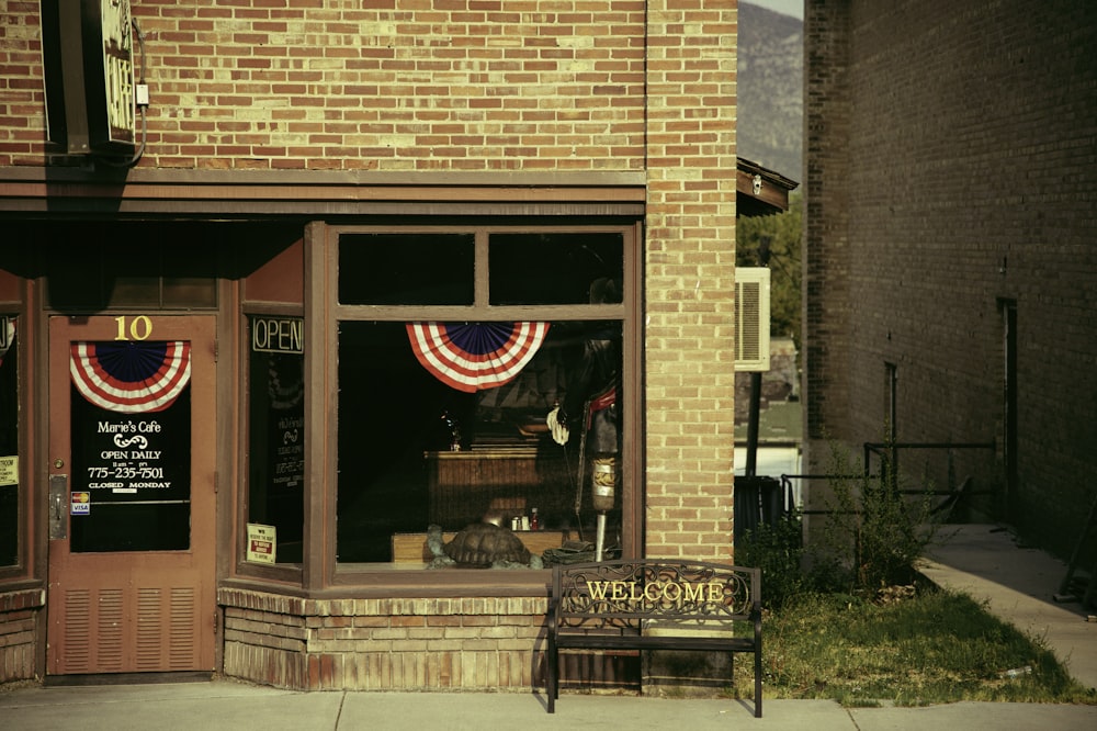 brown brick building with glass window