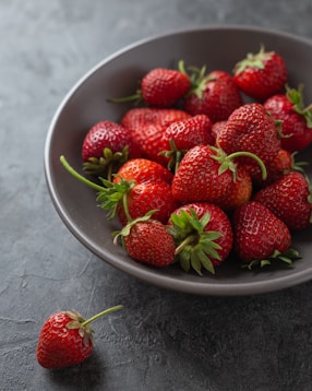 strawberries on white ceramic bowl