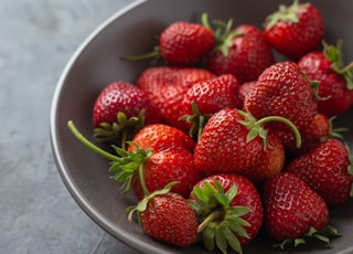 strawberries on white ceramic bowl