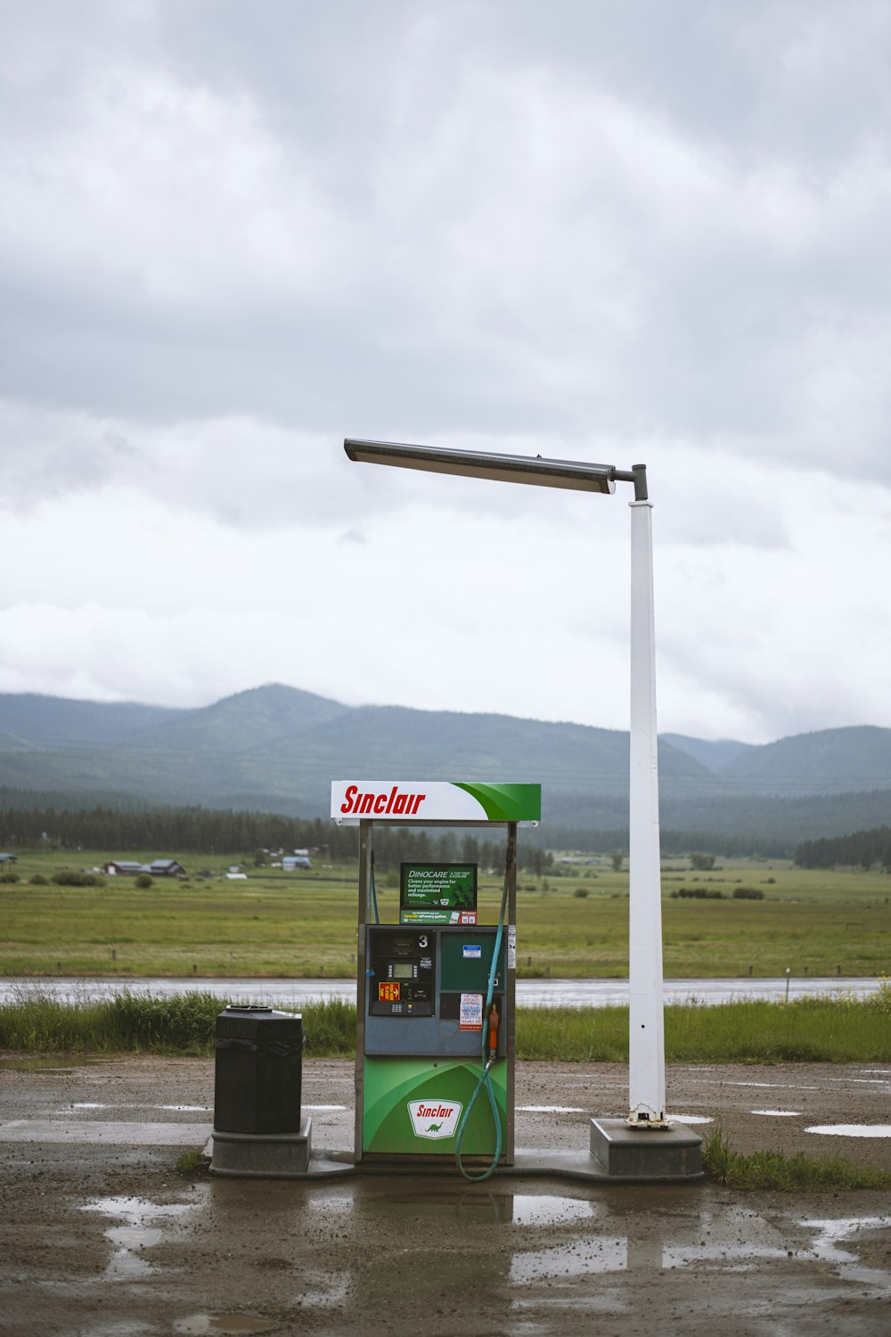 green and white gas pump