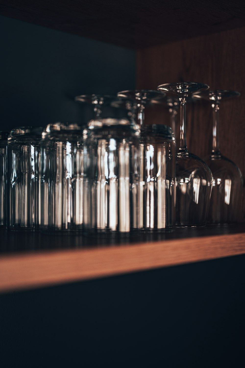 clear glass bottles on brown wooden table