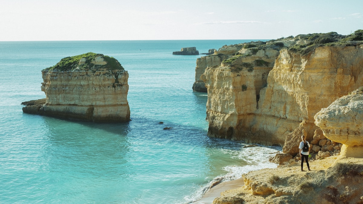 Dramatic coastal cliffs and hiking path along the Algarve coastline in Portugal