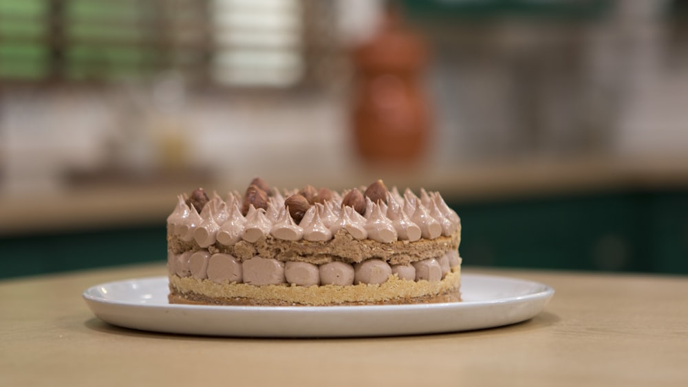 brown and white cake on white ceramic plate