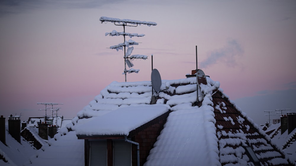 brown wooden house covered with snow during daytime