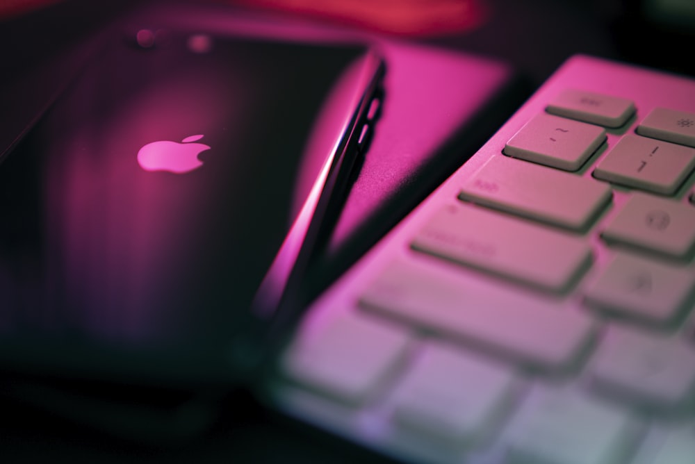 apple logo on black and purple background