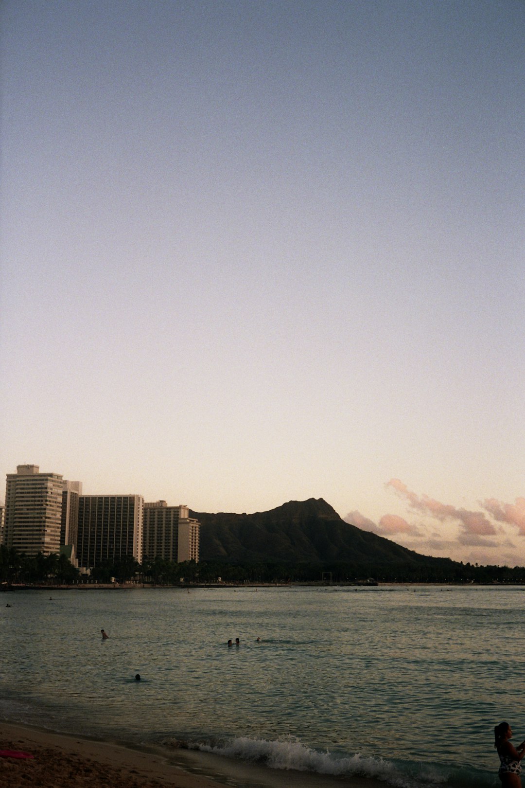 city skyline across body of water during daytime