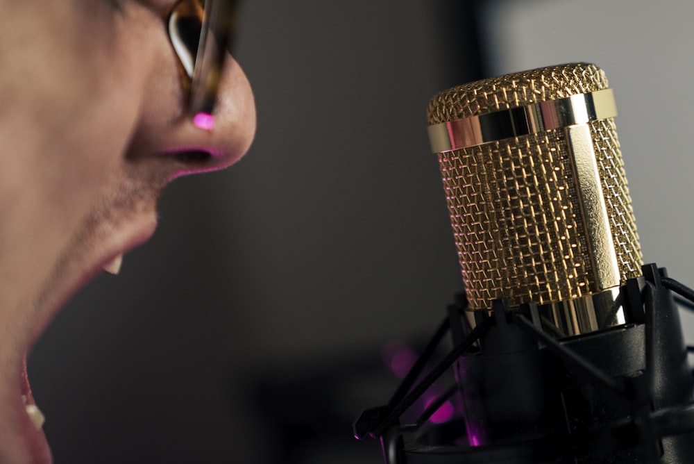 woman in black shirt holding microphone