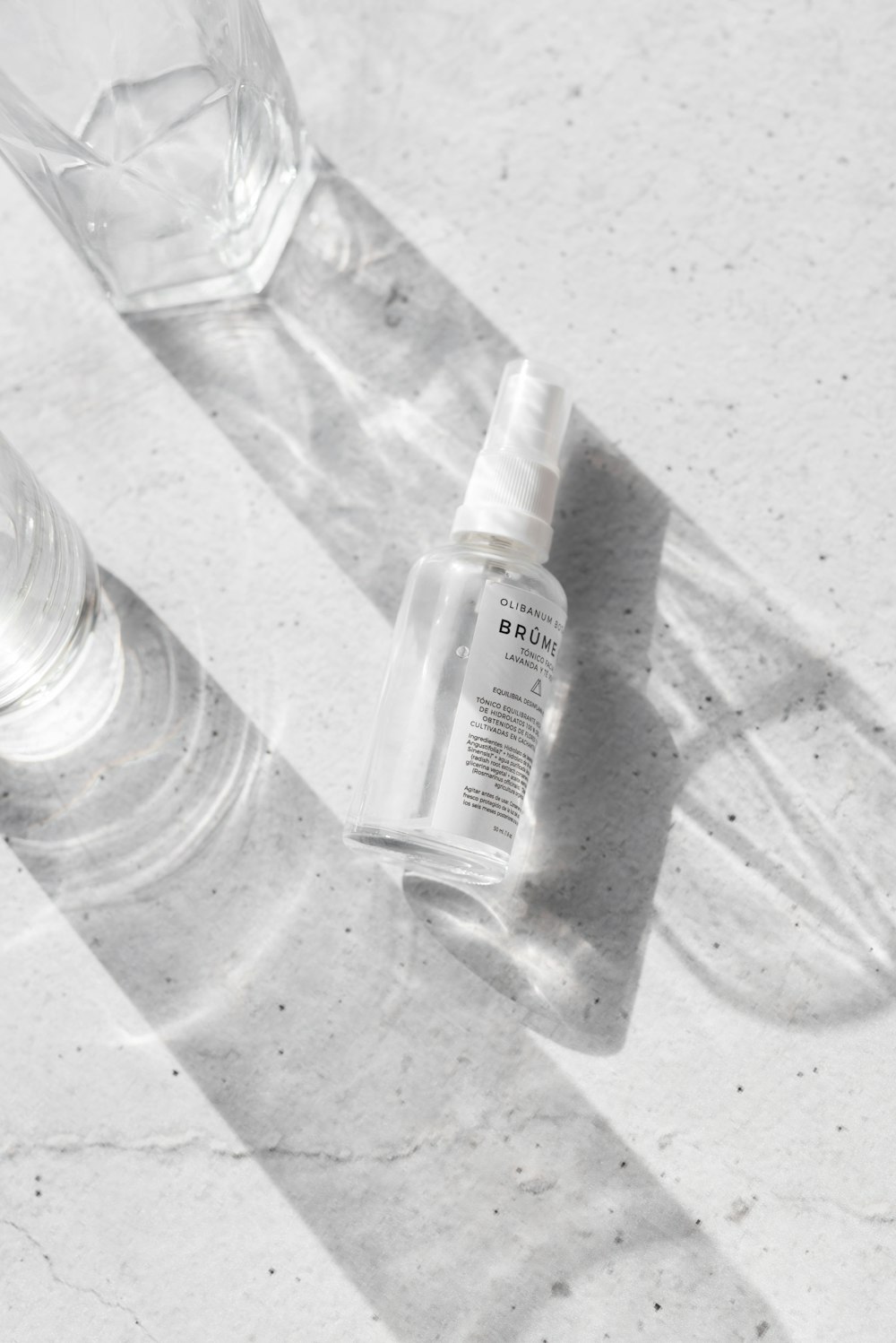 clear plastic bottle on white table