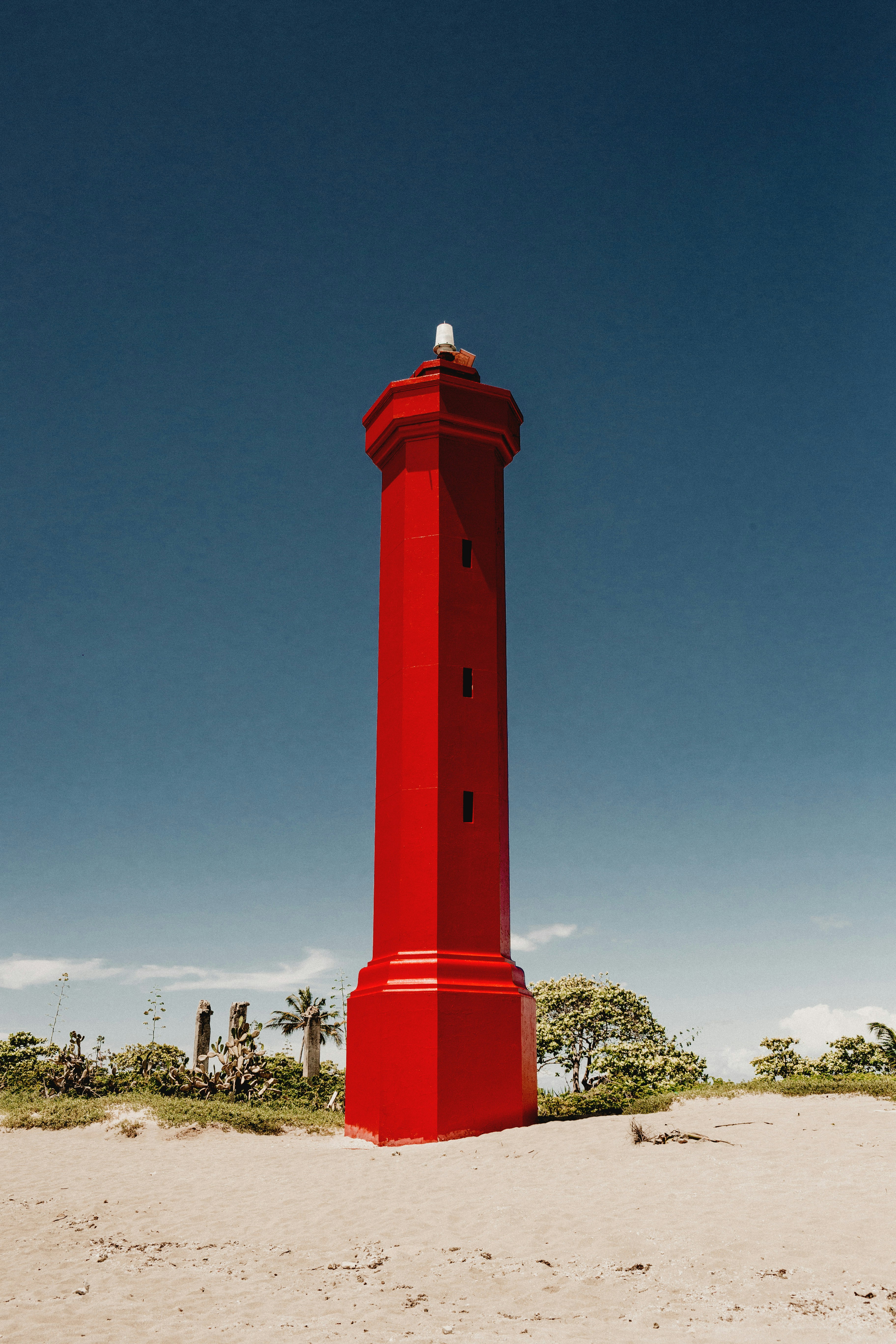 red concrete tower under blue sky during daytime