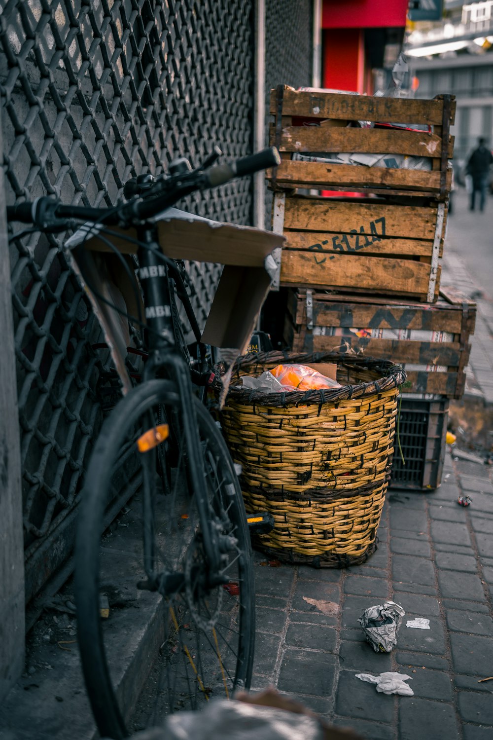brown wooden crate beside black bicycle