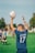 man in blue and white adidas soccer jersey shirt holding white and blue soccer ball