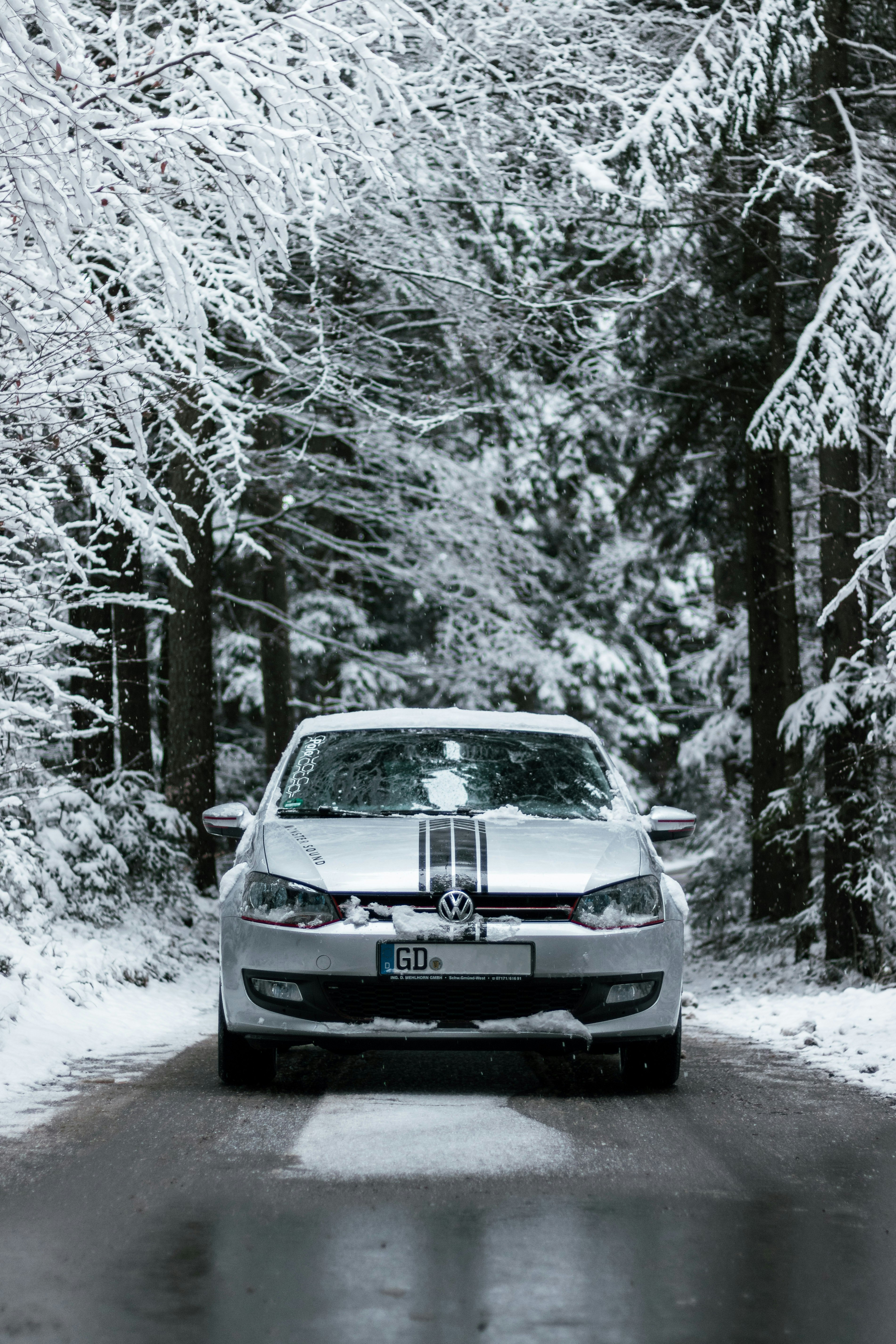 black car on snow covered road