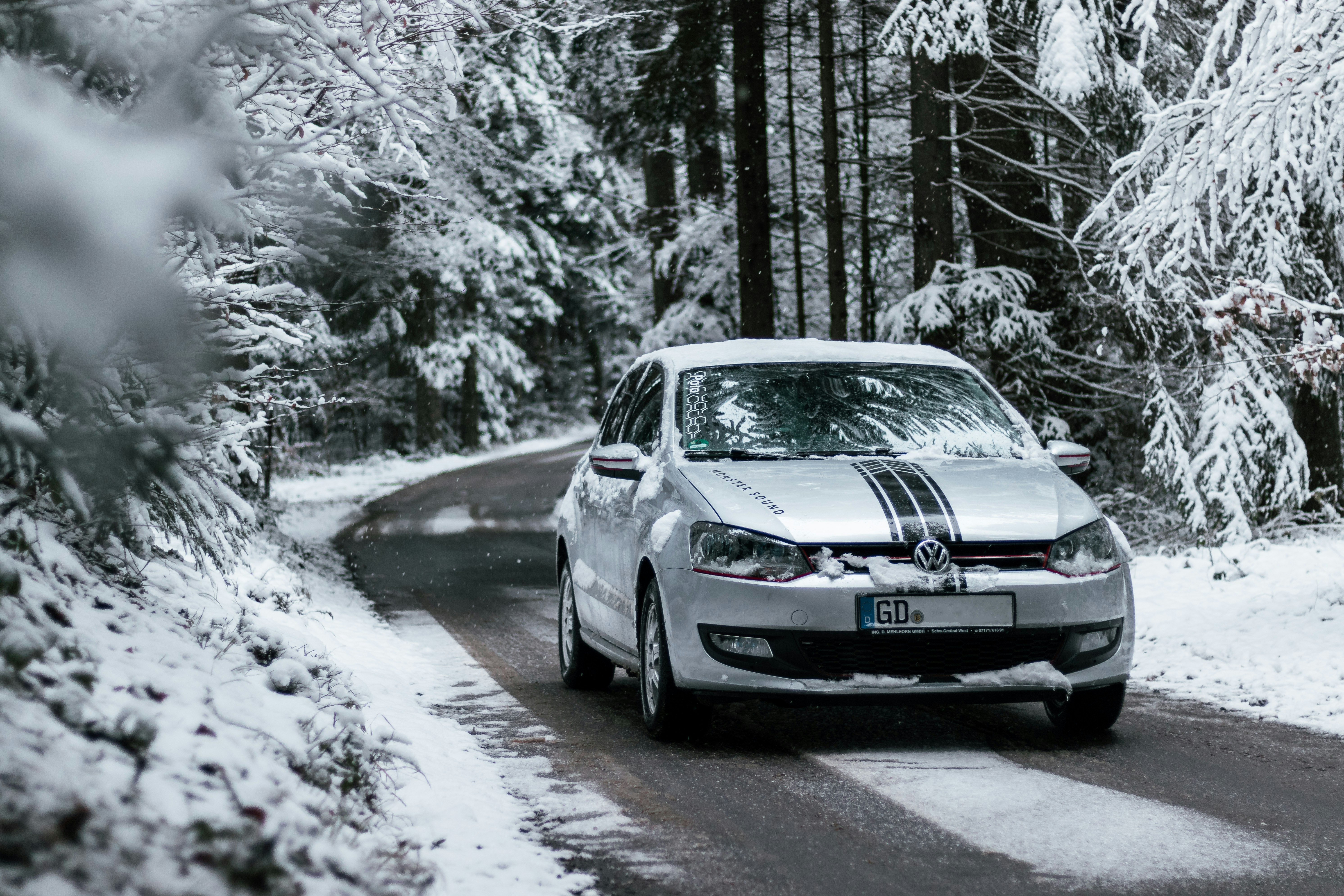 gray bmw sedan on snow covered road