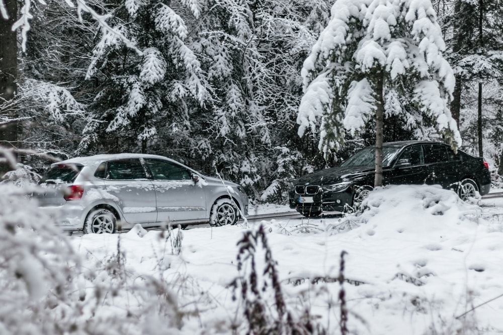 silver sedan on snow covered road during daytime