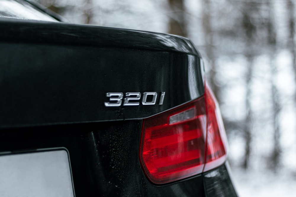 black audi car on snow covered road during daytime