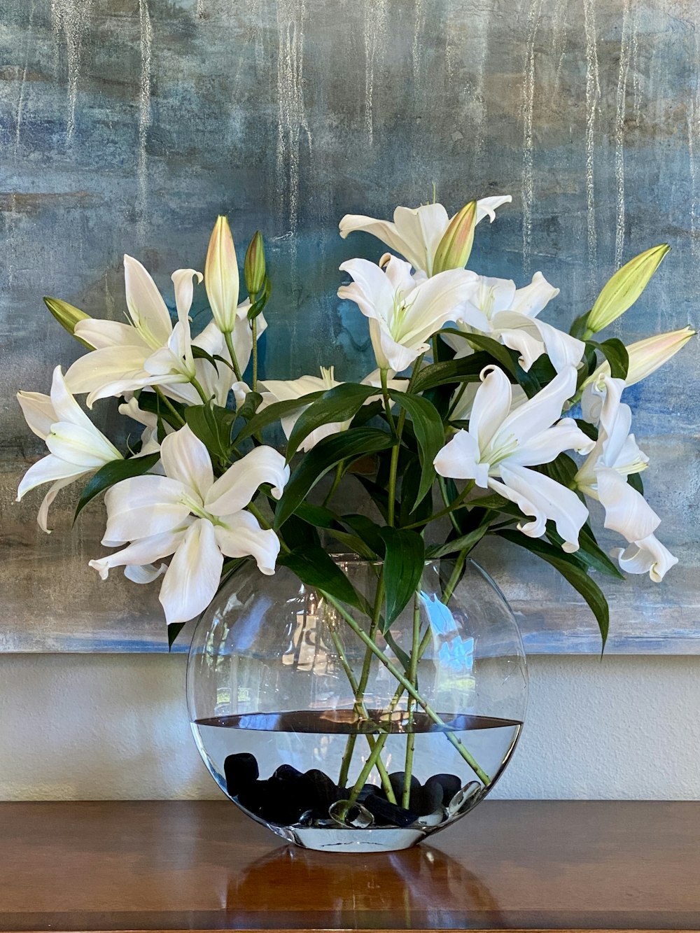 white flowers on clear glass vase