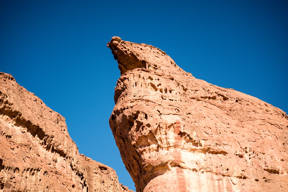 brown rock formation under blue sky during daytime